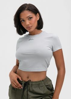 Short Sleeve Baby Tee
Cropped Fit at Waist
Crew Neckline
Custom Front Graphic
55% Cotton 37% Modal 8% Spandex Gray Stretch Cropped Top, Gray Fitted Sporty Crop Top, Gray Fitted Crop Top, Gray High Stretch Casual Tops, Fitted Gray Crop Top, Gray Short Sleeve Crop Top, Trendy Fitted Sports Top, Trendy Fitted Tops For Sports, Gray Sporty Crop Top