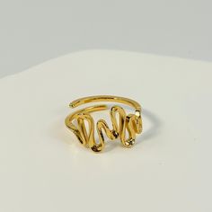 🌻This twisted curve ring features a unique, elegant design that effortlessly adds a touch of sophistication to any outfit. 🥰This piece is meticulously crafted from S925 sterling silver (total 2.6g) and finished with a luxurious coating of genuine 18k gold plating. 🥰This ring is adjustable to fit your desired size. 🥰We will send it in a beautiful jewelry box and package it carefully. We offer boxes in blue, green, white, and black. Please leave a message specifying your preferred color 🥰Plea Modern Twist Yellow Gold Bypass Ring, Minimalist Twisted Gold Rings, Gold Rings With A Modern Twist, Gold Bypass Ring With Modern Twist, Twisted Gold Ring For Gift, Modern Gold Toe Ring, Gold Bypass Ring With Modern Twist For Gift, Modern Twist Gold Bypass Ring As Gift, Elegant Gold Bypass Ring