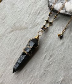 2" long (without the bail) polished black obsidian crystal point, Czech crystals, brass crystal connectors, natural brass chain and lobster clasp. This necklace is adjustable from 24-26" long. To keep the new brass look, clean with brass cleaner or dip in jewelry cleaning solution when needed. ~Visit our new shop Free Spirit Rox for beautiful collectible crystals, gemstones and mineral specimens! https://www.etsy.com/shop/FreeSpiritRox Obsidian Necklace And Earring, Black Spiritual Crystal Necklace With Gemstone, Black Gemstone Crystal Necklace For Spiritual Use, Spiritual Black Crystal Necklace With Gemstone, Spiritual Black Gemstone Crystal Necklace, Black Onyx Gemstone Crystal Necklace, Black Agate Crystal Necklace For Healing, Healing Black Agate Crystal Necklaces, Mystical Black Jewelry For Gifts