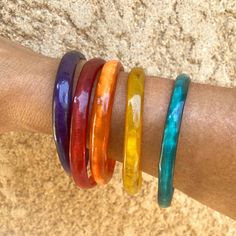 Discover the vibrant colors of our buffalo horn bracelets. Handmade with love, these chic ethnic bracelets are more than a fashion accessory - they embody the very essence of African culture. Handcrafted, the horns are cut, tinted and polished by artisans in Senegal. Making a horn bangle requires many artisanal processes. Unlike plastic products which are mass-produced without human intervention, each horn product is unique, including shapes, patterns and textures, natural scratches, cracks and Fair Trade Bracelets For Gift, Handmade Artisan Bangle, Fair Trade Festival Bracelets, African Bangles, Horn Bracelet, Leather Bangle, Plastic Products, Nature Bracelets, Bracelet Sizes