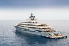 a large white boat floating on top of the ocean