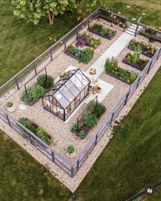 an aerial view of a small garden with lots of plants and flowers in the center