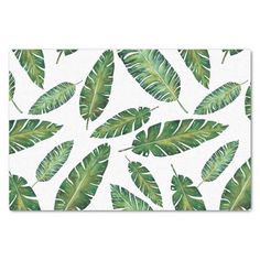 a white and green palm leaf print placemat