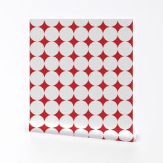 a red and white polka dot pattern on a piece of paper that looks like it has been cut out