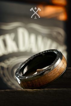 a close up of a wooden ring on top of a table