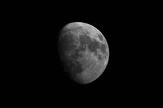 the moon is shown in black and white