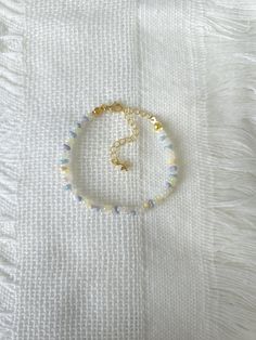 FOR OTHER DAINTY BEADED BRACELETS: https://www.etsy.com/ca/shop/ArtiChouXCanada?ref=seller-platform-mcnav%C2%A7ion_id&section_id=46088511 Bracelet Length: 13-18cm (5.1-7 inches) with a 14k gold filled extender. This bracelet features an array of summer themed pastel colors: blue, white, cream, and light purple Japanese seed beads.  Thread may be visible since it is a handmade product   SIZING  Wrap a soft measuring tape snugly around the widest part of your wrist. Add 1.27cm (0.5in) to that meas Light Blue Beaded Friendship Bracelets As Gift, Elegant Blue Friendship Bracelets With Colorful Beads, Dainty Blue Friendship Bracelets With Colorful Beads, Light Blue Bracelets With Colorful Beads For Jewelry Making, Blue Dainty Beaded Friendship Bracelets, Light Blue Beaded Bracelets For Gifts, Dainty Blue Beaded Friendship Bracelets, Dainty Beaded Blue Friendship Bracelets, Light Blue Beaded Bracelets As Gift