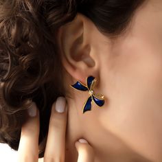 We are so happy to introduce this incredibly beautiful new style. Truly feminine, graceful and elegant earrings to pair up with both your day and evening wear. These gleaming earrings are handmade with 22K gold plated brass and enamel. There are clear zircon stones in the middle of the bow. These nickel free earrings are for pierced ears. They come as a pair with both butterfly and silicone earring backs. These beautiful earrings come with the Milou Jewelry box For avoiding damage to your jewels Elegant Blue Drop Clip-on Earrings, Elegant Gold Clip-on Earrings For Celebration, Fine Jewelry Earrings With Plating For Evening, Fine Jewelry Earrings For Evening, Luxury Blue Earrings For Evening Wear, Luxury Blue Earrings For Evening, Elegant Blue Clip-on Earrings For Formal Occasions, Elegant Formal Blue Clip-on Earrings, Elegant Blue Formal Clip-on Earrings