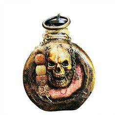 a vase with a skull and chains on the front is shown in this image, against a white background