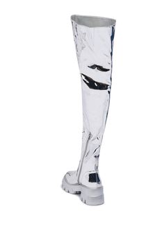 The AZALEA WANG Cortland Silver Thigh High Boot features a glossy silver metallic faux leather upper, a thigh-high shaft, a round toe silhouette, a chunky flatform rubber sole, and a tonal inner ankle zipper closure. Complete with ridged lug sole detailing and an inner elastic thigh panel for subtle stretch. (all measurements are approximate from size 6) - Faux Leather Upper - Round Toe - Chunky Flatform Sole - Thigh High Shaft - 3” Heel Height - 1.5” Sole Height - 25.5” Shaft Height - 15” Calf Circumference - 24.5” Top Shaft Circumference - Imported Product ID: 394985 Azalea Wang, Lug Sole, Thigh High Boots, Thigh High, Thigh Highs, Metallic Silver, Rubber Sole, Heel Height, Leather Upper