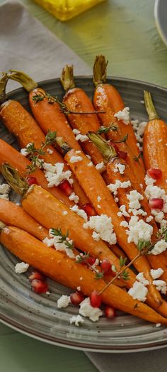 carrots with feta cheese and herbs on a plate