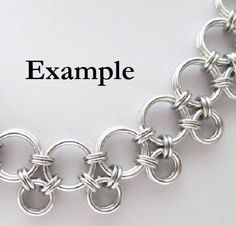 an image of a chainmail bracelet with the word example written below it in black ink