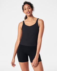 This tank boasts a built-in adjustable shelf bra to your preferred tightness and comfort. Plus, the contoured fit hits at the hip (but doesn’t cover the entire waistband) and keeps distractions at bay when you’re in downward dog. Signature ribbed fabric is textured on the outside and flat on the inside for ultimate all-day wear. | Spanx Women's SPANXshape Get Moving Contour Rib Shelf Tank Top Downward Dog, Adjustable Shelf, Get Moving, Shelf Bra, Ribbed Fabric, Adjustable Shelving, Built In, Tank Top, Tank Tops