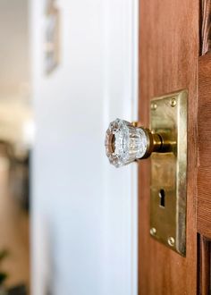 an open door with a glass knob on it