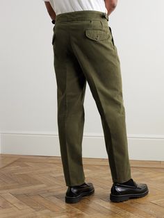 The 'Manny' trousers are one of Rubinacci's best-selling styles. This army-green pair has been made in Italy from cotton-twill and pleated through the front to emphasise the neat, tapered cut. Adjust the tabs on the cummerbund-style waistband for a comfortable, secure fit. Green Tapered Leg Chino Bottoms, Luxury Tapered Ankle-length Chinos, Cotton Chinos With 4-way Stretch And Tapered Leg, Men’s Pleated Trousers, Stretch Tapered-leg Chinos With Pockets, Luxury Sneakers, Driving Shoes, Casual Trousers, Classic Sneakers