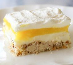 a piece of cake sitting on top of a white plate next to a knife and fork