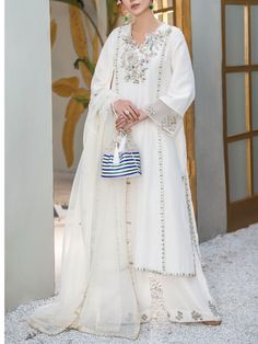 ✨This beautiful white silk long kurta has zari,beads and mirror work over the neck and sleeves and front pannel It has Palazzo pant with motifs and the bottom of the pant,it has orgenza dupatta with lace border and booties on the border of the dupatta. ✨Dazzle with this elegant outfit in any party or wedding function. ✨We stitched outfit with lot of care, so that our customers should not have any issues regarding finishing and fitting. ✨This dress can be customise in any other colour and in all Long Kameez, Designer Salwar, Embroidered Pants, Designer Salwar Suits, Wedding Function, Plus Size Designers, Salwar Suit, Star Dress, Pakistani Outfits