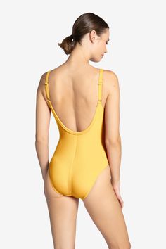 Our Amy v-neck one piece is an essential swim piece with a twist. It's deep neck, low back, and gold details makes this the perfect suit. A piece that is the perfect amount of skin exposure. Product Details: - V-neck one piece with snap hardware details- Removable cups- Adjustable straps- Minimal coverage- 92% nylon, 8% spandex- Style: 220813 Gold Backless Swimwear For Pool, Fitted V-neck Swimwear With Lined Body, Elegant Gold Stretch Swimwear, Second-skin V-neck Swimwear For Swimming, Gold Beachwear Bodysuit For Swimming, Fitted V-neck Swimwear With Tie Back, Fitted V-neck One Piece For Poolside, Fitted V-neck Swimwear With Adjustable Straps, Gold One-piece Swimwear For Poolside