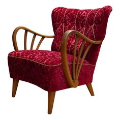 a red chair with wooden arms and legs