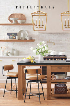 an image of a kitchen setting with pots and pans on the stove top island