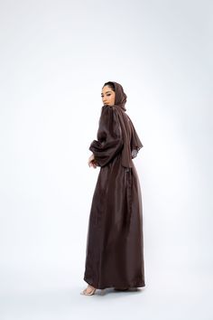 The Organza Abaya is statement outfit for any event. It's super lightweight yet so simple with the prettiest sheen. Complete the look with our matching long sleeve satin slip dress and a pair of strappy heels for a luxe finish or make it into a more casual look. *Please note that the color displayed in the picture might be slightly different due to the color resolution and lighting. Fabric Description & Care: Balloon Sleeves with elastic cuff Double Lined Material: Silk/Organza Dry Clean for bes Evening Satin Maxi Abaya, Evening Satin Maxi-length Abaya, Silk Abaya For Eid Party, Satin Evening Abaya For Eid, Elegant Silk Maxi Abaya, Eid Evening Satin Abaya, Elegant Satin Maxi Abaya, Eid Party Silk Abaya, Silk Maxi Abaya For Eid