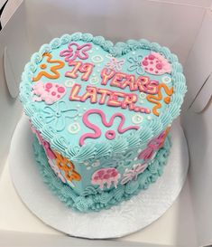 a heart shaped birthday cake in a box