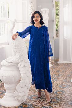 Luxury Navy Blue Embroidered Pakistani Salwar Kameez in Chiffon comes with sequin-Embroidered Chiffon, chic cutwork, raw silk bottoms, and embroidered dupatta exudes elegance. Chiffon Kameez: Pakistani Embroidered Salwar Kameez Chiffon is emblazoned with lavish floral designs, motifs, and delicate embroidery. Beaming sequins and threads make this beautiful kameez in an alluring blue color a perfect choice to wear for the festive occasion. Raw Silk Trousers: Embroidered kameez is paired with trousers to create a magnificent Pakistani Salwar Kameez. The trousers are in raw silk fabric and their borders are emblazoned with embroidery and lace work. Chiffon Dupatta: Pakistani Salwar Kameez achieves the final ravishing look when paired with a delicate chiffon dupatta. Embroidered scalloped bord Pakistani Salwar, Raw Silk Fabric, Organza Sleeves, Pakistani Salwar Kameez, Silk Bottoms, Embroidered Chiffon, Embroidered Dupatta, Dresses Chiffon, Formal Outfits