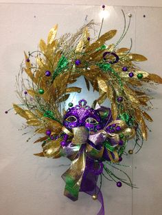 a mardi gras wreath hanging on the wall