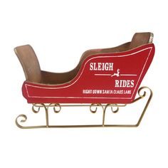 a red sleigh rides on a white background