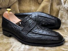 Bespoke Pure Handmade Alligator Textured Black Color Genuine Leather Slip On Loafers For Men Product Details: Material: Alligator Textured Genuine Leather Upper: Crafted from genuine leather for a luxurious look and feel. Inner: Lined with soft leather, ensuring comfort throughout the day. Sole: Made of durable leather for long-lasting quality. Heel: Features a leather heel for added elegance. Craftsmanship: Handcrafted: Each pair is meticulously hand-stitched to perfection. Manufacturing Time: Business Black Loafers With Crocodile Pattern, Business Black Crocodile Pattern Loafers, Semi-formal Black Leather Shoes With Crocodile Pattern, Black Leather Shoes With Crocodile Pattern For Business, Black Crocodile Pattern Leather Shoes For Business, Semi-formal Black Crocodile Pattern Leather Shoes, Black Crocodile Pattern Loafers With Round Toe, Black Crocodile Pattern Round Toe Loafers, Black Leather Shoes With Alligator Pattern