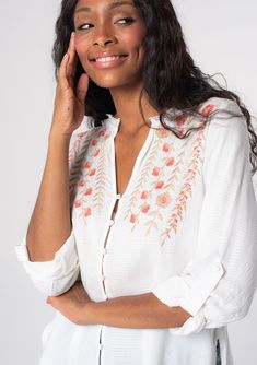 [Color: Ivory/Coral] A model wearing a soft white bohemian button front shirt with long rolled sleeves and floral embroidered details. Vintage Floral Embroidery, Bohemian Wrap, Bohemian Blouse, Wardrobe Refresh, Bohemian Top, Blouse Embroidery, Bohemian Blouses, Bohemian Tops, Embroidery Blouse