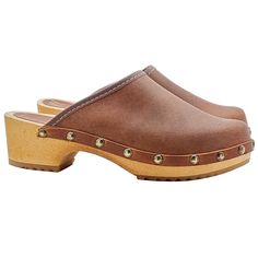 Swedish clogs with wooden structure Upper in genuine brown leather and 4.5 cm heel Made entirely by specialized Italian personnel Handcrafted using the best materials Closed Toe Mules With Wooden Heel, Wooden Slip-on Mules, Brown Wooden Clogs With Wooden Heel, Wooden Mules With Rubber Sole And Round Toe, Brown Wooden Mules With Round Toe, Brown Wooden Heel Clogs, Brown Wooden Round Toe Mules, Brown Wood Mules With Round Toe, Brown Wood Slip-on Clogs