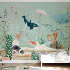 an ocean themed wallpaper mural in a child's room