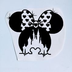 a black and white mouse with hearts on it's head is shown in the shape of a heart