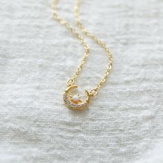 "Beautiful and lovely gold moon necklace made of tiny cubic and opal gold moon charm with skinny gold plated brass chain. The soft and warm-looking necklace is good for yourself or gift! Your necklace will ship in a rudiana gift box. ♥Length 14\" - 20\" ♥Moon charm 1/2\" x 1/2\" ♥Gold plated over brass / Cubic Zirocnia / Opal stone ♥ Delivery Time Fast shipping within 1 - 3 days ♥ See more Rudiana Accessories Rudiana.etsy.com" Gold Crescent Moon, Gold Moon Necklace, Celestial Necklace, Gold Cross Necklace, Gold Charm Necklace, Gold Moon, Moon Charm, Stone Gold, Opal Stone