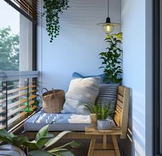 a balcony with plants and pillows on it