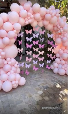 a bunch of balloons that are in the shape of butterfly's and pink butterflies