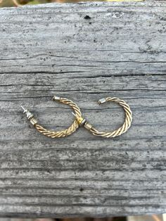 Hoop earrings in braided twisted shape, gold and silver tone, stud post backs. Gold Twisted Metal Earrings, Gold Twisted Metal Hoop Earrings, Gold Twisted Earrings, Braided Twists, Gold And Silver, Jewelry Earrings Dangle, Dangle Drop Earrings, Silver Tone, Dangle Earrings