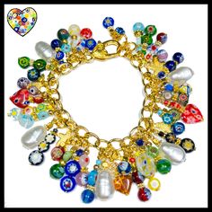 "Lovely colorful millefiori beads mixed with pearls and star charms make this bracelet a winner! So vibrant and bright you can't help but smile! I made this bracelet with: ~Glass millefiori beads ~Gold plated stainless chain ~Large lobster clasp ~Gold spacer beads ~Drop pearls ~Gold stars 7 3/4\" length with adjustment chain" Multicolor Pearl Charm Jewelry Gift, Multicolor Pearl Charm Jewelry As Gift, Multicolor Jewelry With Pearl Charm For Gift, Multicolor Jewelry With Pearl Charm As Gift, Multicolor Pearl Charm Bracelet, Multicolor Dangle Charm Bracelet, Multicolor Charm Bracelet With Dangling Charms, Handmade Multicolor Dangle Charm Bracelet, Multicolor Heart Beads Charm Bracelet