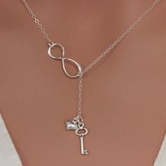 "Sterling Silver Infinity Key heart Necklace The picture length is 17\", it could be shorter or longer , depend on customer request. It consists of... -Sterling Silver key charm, -Sterling Silver Heart charm, -Sterling Silver Infinity link, and -Sterling silver chain with spring claw. -Come up with small ribbon gift Box , pr-made Massage Card as well and -One set of care instruction package . MORE HEART NECKLACES https://www.etsy.com/shop/rainbowearring/search?search_query=heart+&order=date_ Nickel-free Charm Necklaces As Birthday Gift, Nickel Free Charm Necklaces For Valentine's Day, Mother's Day Silver Lariat Necklace, Silver Lariat Necklace For Mother's Day, Valentine's Day Dainty Lariat Necklace, Heart-shaped Lariat Necklace For Anniversary, Heart Pendant Charm Necklace For Birthday Gift, Heart Charm Necklaces For Birthday, Elegant Silver Lariat Necklace For Valentine's Day