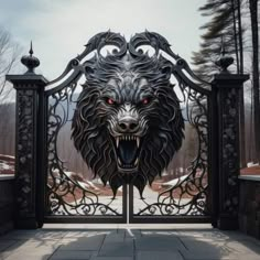 an iron gate with a wolf's head on it and red eyes in the center