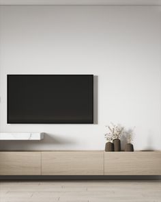 a flat screen tv mounted to the side of a wall