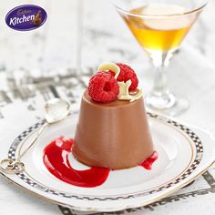 a small chocolate dessert with raspberries on top