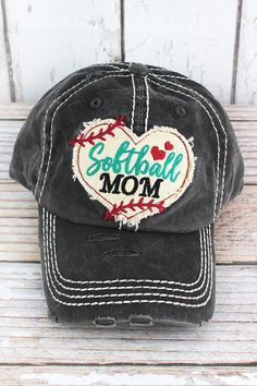 a baseball cap with the word softball mom written on it and a heart in the middle