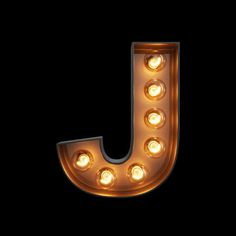 the letter j is lit up with light bulbs