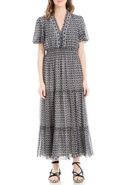 A smocked waist defines the silhouette of a maxi dress finished in a bold pattern for eye-catching appeal. 52 3/4" length Surplice V-neck Short sleeves Lined 100% polyester Machine wash, line dry Imported Smocked Maxi Dress, Puff Sleeve Midi Dress, Floral Print Midi Dress, Daytime Dresses, Sleeve Midi Dress, Dress Shapes, Max Studio, Modest Dresses, New Woman