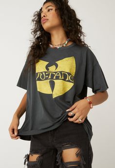 Featured on our premier Wu-Tang Clan style, the acronym stands for “Cash Rules Everything Around Me,” and its slightly baggy fit. Pre-shrunk Hip Hop Tops For Streetwear, 90s Graphic T-shirt For Streetwear, 90s Band Logo Crew Neck Top, 90s Band Logo Tops With Crew Neck, 90s Logo Print Tops For Streetwear, 90s Style Relaxed Fit Tops For Streetwear, 90s Band Logo Relaxed Fit Top, 90s Style Tops For Music Festivals Fan Merchandise, 90s Band Logo Top With Relaxed Fit