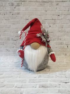 the gnome is wearing a red and white hat