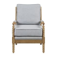 an upholstered chair with wooden legs and a beige fabric seat pad on the back