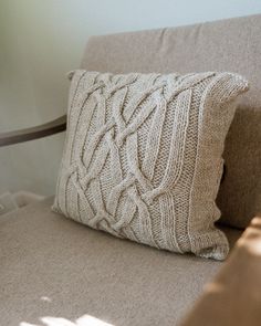 a close up of a pillow on a couch